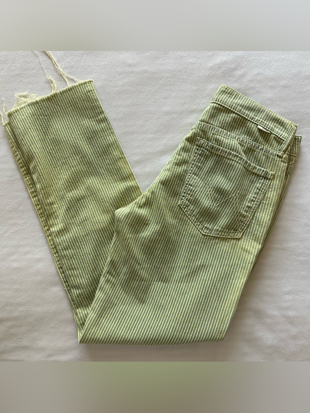 mother brand green striped lightweight denim w raw hems / size 28